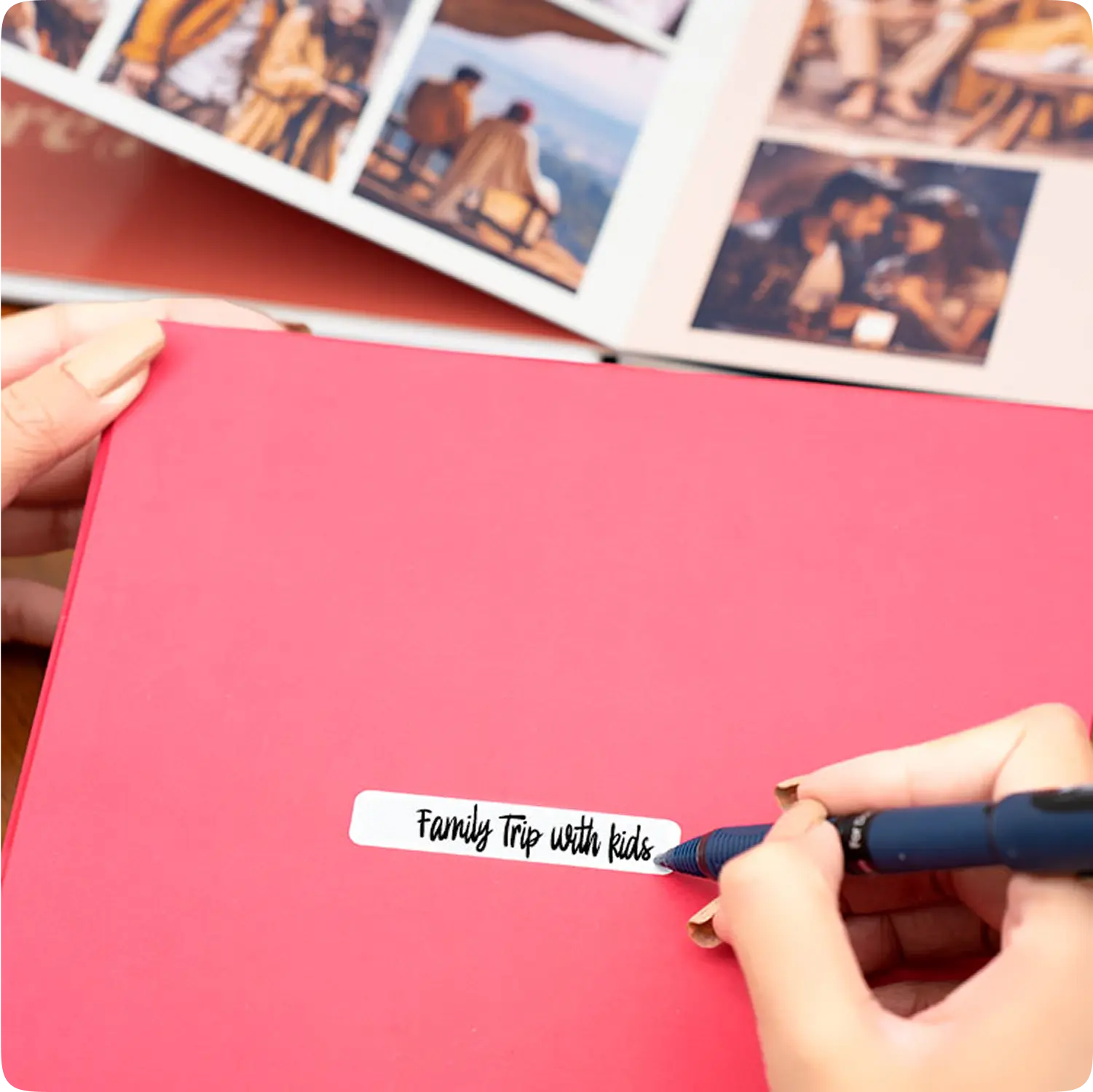Color Kahar (colorkahar) square layflat leather cover photobook — hands writing Family Trip with kids on pink cover personalized Pakistan