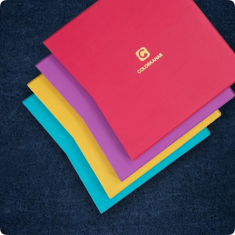 Color Kahar (colorkahar) square layflat textured cover photobooks — pink purple yellow cyan colorful stack with ColorKahar logo Pakistan
