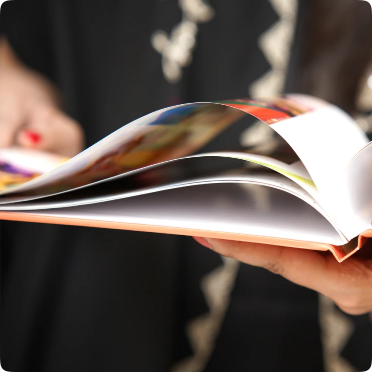 Color Kahar (colorkahar) square flexi photobook — hands holding flexible pages close up display personalized Pakistan